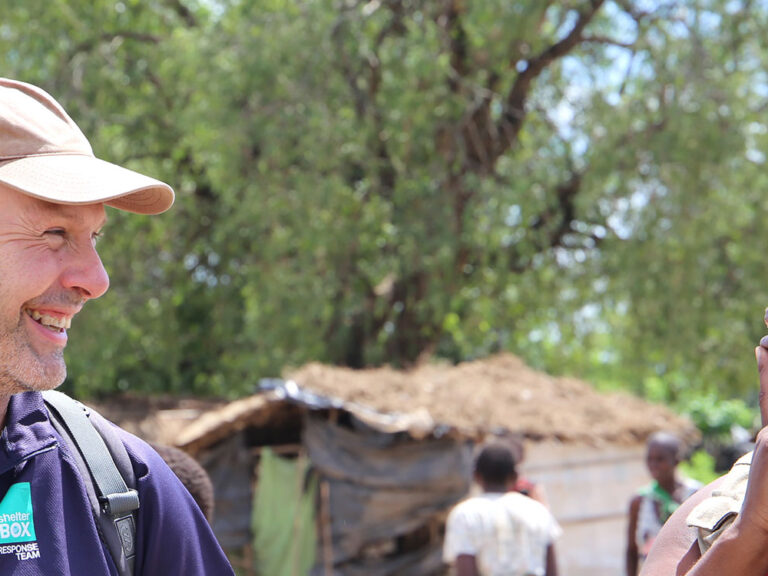 man from shelterbox and woman from habitat for humanity in malawi