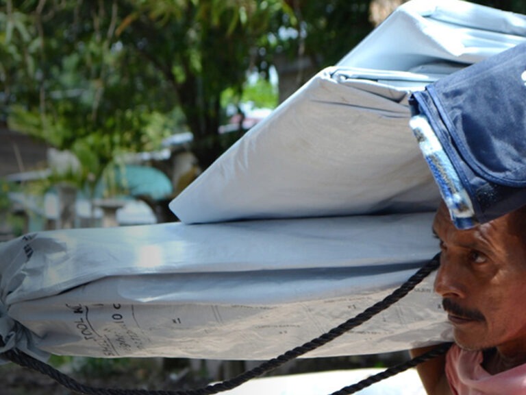 Man carrying aid
