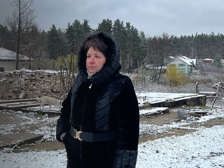 Ukrainian woman stands in the snow
