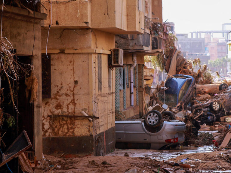 Debris and damaged buildings in a street in Derna in Libya after flooding