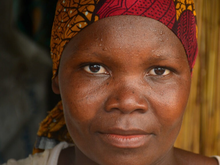 woman wearing a red hair shawl