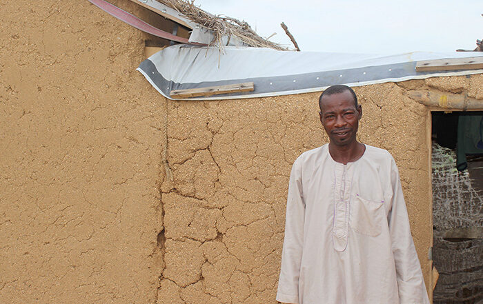 Man standing outside a shelter in Cameroon