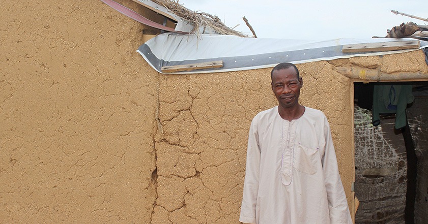 Man standing outside a shelter in Cameroon