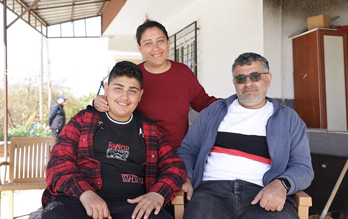 Three people smiling to the camera in Turkey