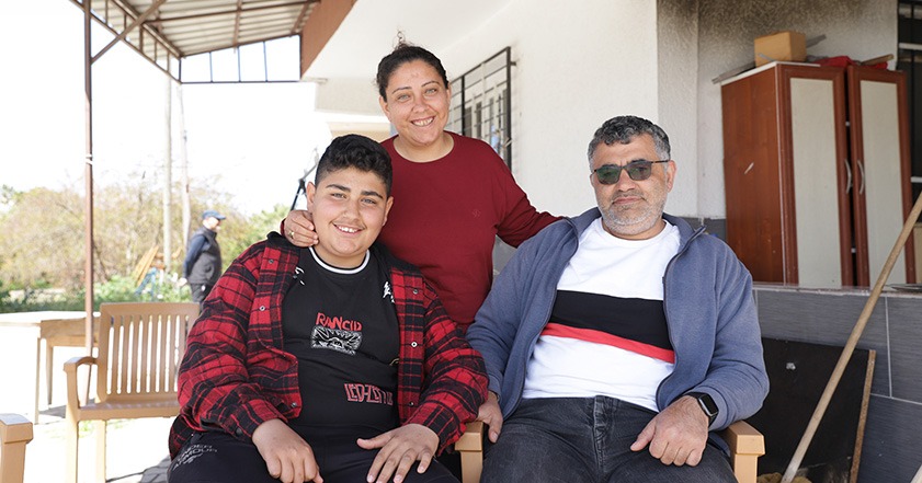 Three people smiling to the camera in Turkey