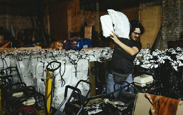 Man carrying a shelter kit in Ukraine