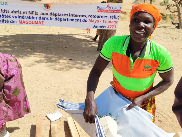 Woman holding aid in Cameroon