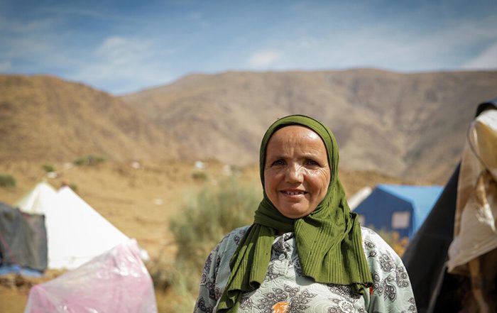 Woman standing among tents in Atlas Mountains in Morocco