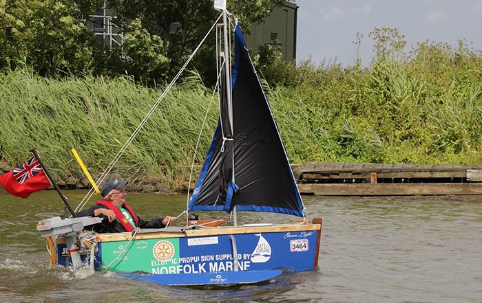 Man in homemade boat on river