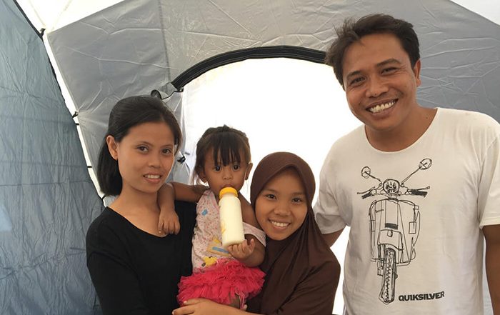 Family in Indonesia in a tent